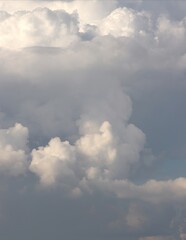 A close-up of the cloudy sky. Color background. Soft shapes. Simple composition. Abstract environment. Atmosphere of presence. Picture. Wallpaper. Poster. Postcard. Place to insert