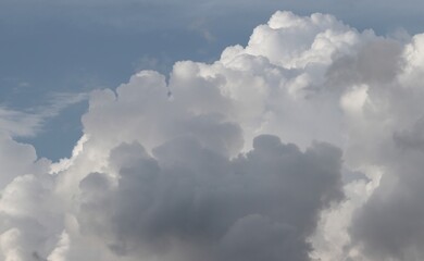 A close-up of the cloudy sky. Color background. Soft shapes. Simple composition. Abstract environment. Atmosphere of presence. Picture. Wallpaper. Poster. Postcard. Place to insert
