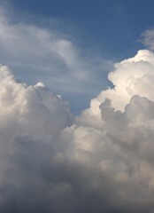 A close-up of the cloudy sky. Color background. Soft shapes. Simple composition. Abstract environment. Atmosphere of presence. Picture. Wallpaper. Poster. Postcard. Place to insert