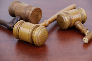 Legal system, court problems concept. Three judge gavels, two gavels broken.
