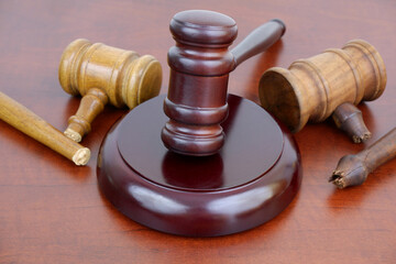 Court and laws changing concept. Three judge gavels, two wooden gavel broken.