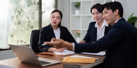 Legal Consultation and Digital Strategy. Lawyers using technology for a client meeting.