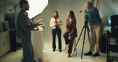 Makeup artist, model and photographer together in studio for discussion, photoshoot or planning....