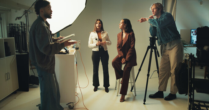Makeup artist, model and photographer together in studio for discussion, photoshoot or planning. Backstage, creative and media with photography people on set for collaboration, conversation or review - Powered by Adobe
