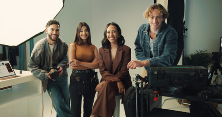 Camera, photography and portrait with people in studio together for catalog or magazine photoshoot. Backstage, creative or smile with happy makeup artist, model and photographer on set for film