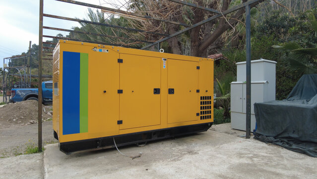 Yellow mobile diesel generator for emergency electrical power.