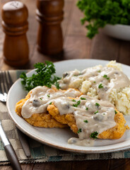 Fried chicken cutlets with mashed potatoes and gravy