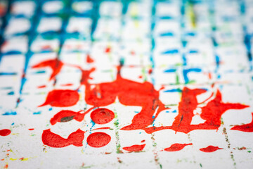 Extreme close up of colorful acrylic paint texture showing brush strokes. Selective focus.