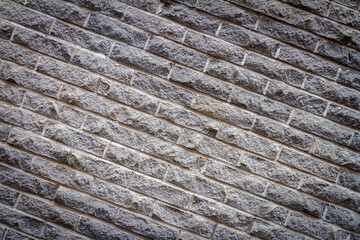 Background of old gray distressed brick wall texture, abstract architecture wallpaper.