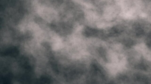 Thick wall of smoke drifting up in slow motion. Intricate textured dense fog, smoke, dust or debris backdrop seamless looping animation.