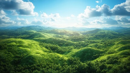 Naklejka premium A breathtaking view of lush green hills under a bright blue sky with fluffy clouds, showcasing the beauty of nature.