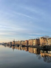 A morning walk through Amsterdam on a spring day with blue sky. The sun was coming up and the city comes slowly to life.