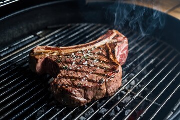 Grilled steak with seasoning on a barbecue grill during a summer cookout