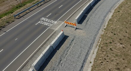 Road Shoulder Closed Alert on Highway with Concrete Barriers and Gravel