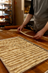 Artisan Baker Preparing Twisted Breadsticks Dough