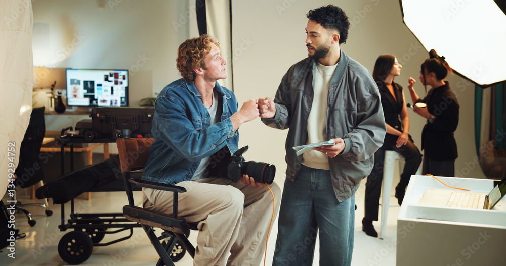 Poster fist bump, photography and teamwork with people in studio together for behind the scenes production.