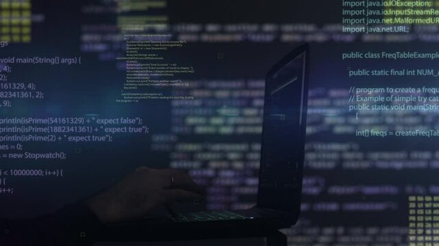 Hacker writing code cracking computer. Programming code in the background. Hacker attack, cybercrime, virus software, dark web, cyber security concept.