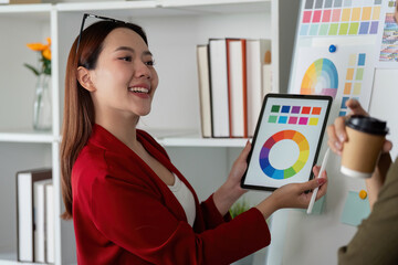 Creative Collaboration and Color Presentation. Team member showcases color options using digital tools to teammates.