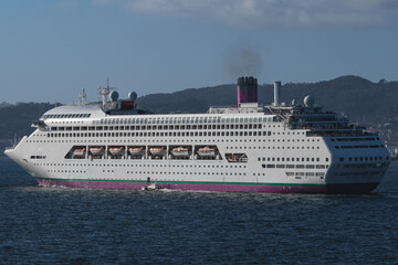 Classic cruiseship cruise ship liner Ambience sail away departure from Vigo port, Spain in Galicia...