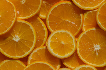 Freshly sliced oranges create a vibrant and zesty display, perfect for summer refreshment and culinary delights