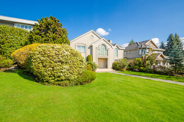 Two story luxury house with beautiful summer  landscape in Vancouver, Canada, North America. Day...