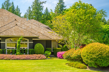 Two story luxury house with beautiful summer  landscape in Vancouver, Canada, North America. Day...