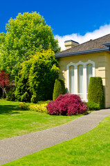 Two story luxury house with beautiful summer  landscape in Vancouver, Canada, North America. Day...
