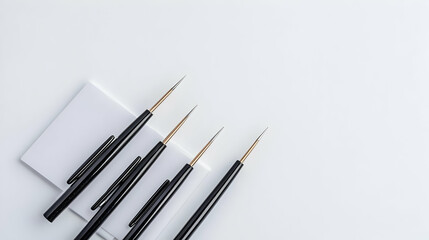 Fototapeta premium Set Of Small Paintbrushes On White Background