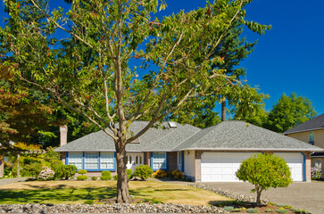 Two story luxury house with beautiful summer  landscape in Vancouver, Canada, North America. Day time on June 2024