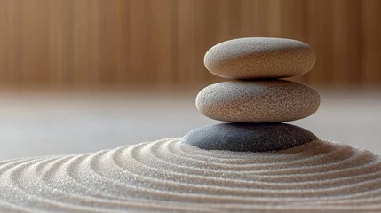 Selbstklebende Fototapeten Stacked stones on a raked sand zen garden © zalfa_std98
