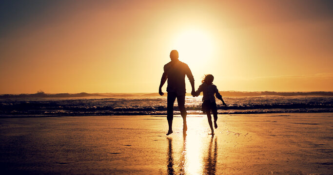 Ocean, sunset and father with girl, holding hands and travel with happiness, bonding together and wellness. Nature, beach and family with parent, daughter and dad with summer holiday and silhouette