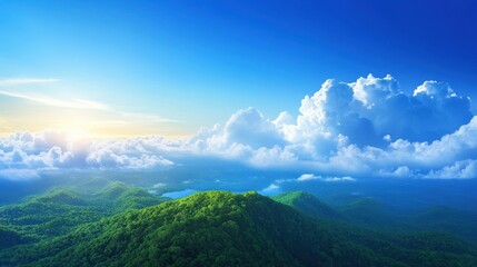 Obraz premium A breathtaking view of lush green mountains under a bright blue sky adorned with fluffy clouds, capturing the beauty of nature at sunrise.