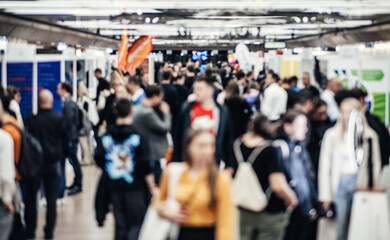 Abstract blurred people at exhibition hall of expo event trade show. Business convention show or...