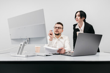 Specialists in the office discuss and solve the problem of declining sales and revenues. The concept is to show teamwork, analysis, and decision-making to restore business success in times of crisis.