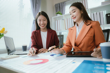 Businesswoman working with colleagues to define creative solutions strategies for organizational growth and leadership in the digital age.