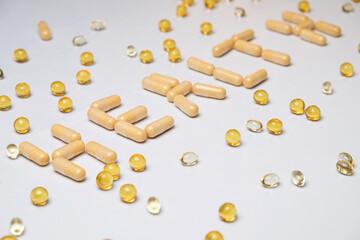 Creative arrangement of vitamins and gels on a bright surface for health