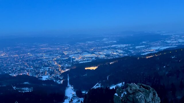 Evening view of the city of Liberec and snow-capped mountains with a bright sky at sunset. High quality 4k footage