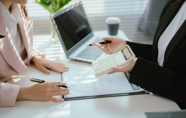 Real estate agents and new homeowners discuss mortgages and insurance coverage for safe investment and ownership.