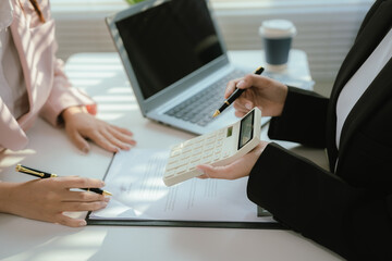 Real estate agents and new homeowners discuss mortgages and insurance coverage for safe investment and ownership.