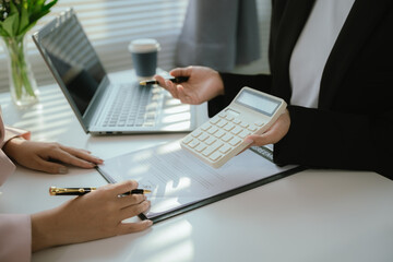 Real estate agents and new homeowners discuss mortgages and insurance coverage for safe investment...