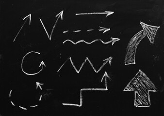 Tactic plan. Hand drawn arrows as strategy scheme sketch, isolated on on the black chalkboard....