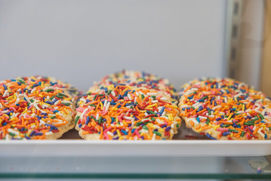 Colorful Sprinkle Cookies on Bakery Display Tray - Dessert Photography