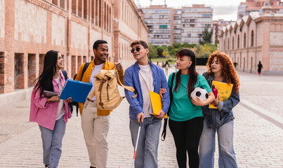 Blind university student walking with friends on campus after class