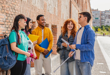 Blind university student smiling and talking with friends on campus