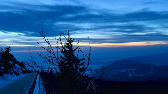 Evening view of snowy mountains and bright sky at sunset. High quality 4k footage