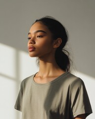 Portrait of a Young Woman in Olive Green T Shirt, Lit by Window Light