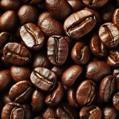 Fototapeta premium A close-up view of roasted coffee beans. They are a rich, dark brown color with a glossy sheen, indicating the presence of natural oils released during roasting. 