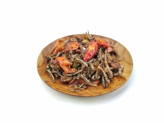 Fried anchovies on plate isolated on white background 