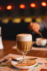 A glass of latte in a cozy cafe