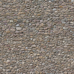Stone texture of seamless riverstone rubble wall background
